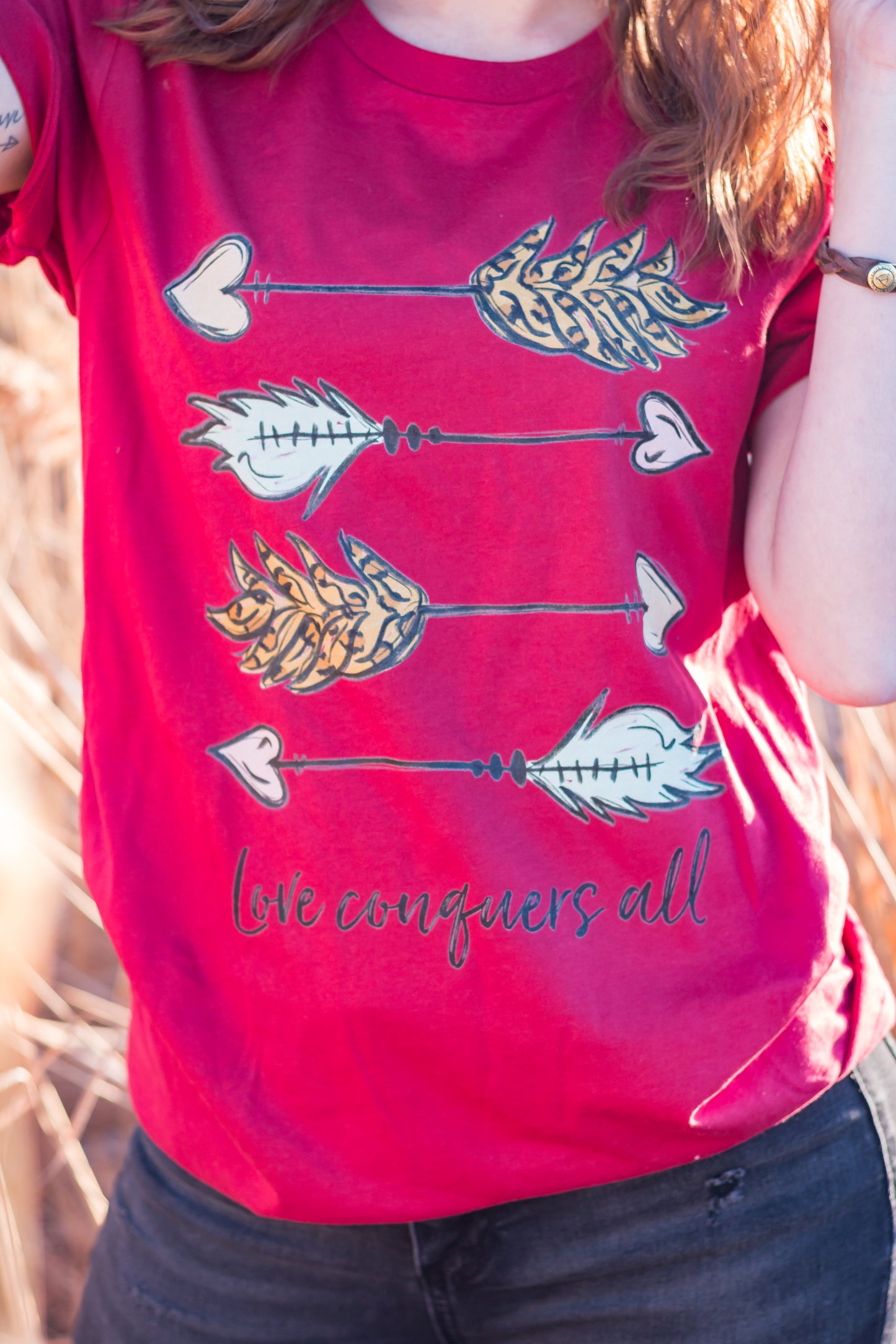 Love Conquers All Graphic Tee